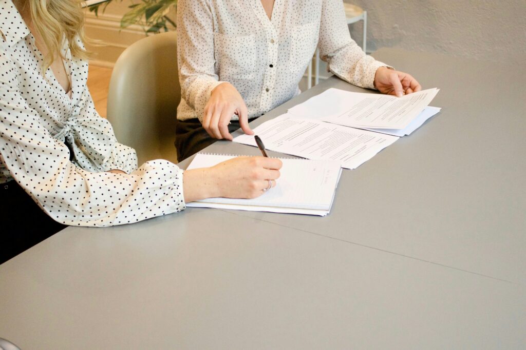 Two women signing a document.

What is a mobile notary?